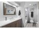 Modern bathroom features a stylish vanity, updated fixtures, and a shower-tub combination at 9700 W 88Th Pl, Westminster, CO 80021