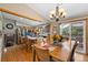 Open kitchen and dining area with island, stainless appliances, and access to the outdoor patio at 9700 W 88Th Pl, Westminster, CO 80021