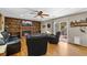 Cozy living room with built-in bookshelves, a fireplace, hardwood floors, and sliding glass doors to backyard at 9700 W 88Th Pl, Westminster, CO 80021