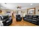 Inviting living room featuring hardwood floors, comfortable seating, and natural light at 9700 W 88Th Pl, Westminster, CO 80021