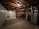 An unfinished basement with exposed ceiling and cement floors is ready to be converted into living space at 2033 Espana Way, Aurora, CO 80011