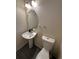 Powder room with a pedestal sink and an oval mirror at 2033 Espana Way, Aurora, CO 80011
