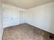 Empty bedroom with carpet and closet with sliding doors at 2033 Espana Way, Aurora, CO 80011