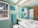 Mint green bathroom featuring a large mirror, towels, toilet, and shower at 3086 W 107Th Pl # F, Westminster, CO 80031