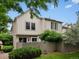 Home exterior with a well-manicured lawn, privacy fence, mature trees and shrubs at 3086 W 107Th Pl # F, Westminster, CO 80031
