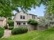 Home exterior with a well-manicured lawn, privacy fence, mature trees and shrubs at 3086 W 107Th Pl # F, Westminster, CO 80031