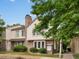 Charming two-story townhome with brick accents, mature landscaping, and a classic chimney at 3086 W 107Th Pl # F, Westminster, CO 80031