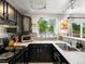 Updated kitchen showcases sleek appliances, dark cabinetry, and modern track lighting at 3086 W 107Th Pl # F, Westminster, CO 80031