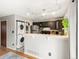 Modern kitchen with stainless steel appliances and stacked washer and dryer at 3086 W 107Th Pl # F, Westminster, CO 80031