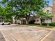 A parking area in front of townhomes, with landscaping and available spaces at 3086 W 107Th Pl # F, Westminster, CO 80031
