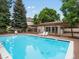 Inviting community pool with pergola covered deck and lounge chairs at 3086 W 107Th Pl # F, Westminster, CO 80031