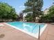 Community swimming pool with lounge chairs and a fenced perimeter at 3086 W 107Th Pl # F, Westminster, CO 80031