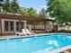 Inviting community pool with lounge chairs and pergola covered deck at 3086 W 107Th Pl # F, Westminster, CO 80031