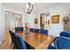 Bright dining room featuring a large wooden table, comfortable seating, and decorative accents at 3102 Fox Sedge Pl, Highlands Ranch, CO 80126
