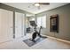 Bright exercise room featuring a stationary bike and fitness equipment, perfect for workouts at 3102 Fox Sedge Pl, Highlands Ranch, CO 80126