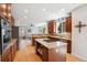 Spacious kitchen with granite countertops, stainless steel appliances, and a view into the living room at 3102 Fox Sedge Pl, Highlands Ranch, CO 80126