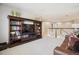 Upstairs living room featuring a large built-in bookshelf and entertainment center at 3102 Fox Sedge Pl, Highlands Ranch, CO 80126