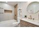 Bathroom features modern fixtures, a bathtub and shower combination, and vanity with storage at 5555 Julian St, Denver, CO 80221