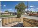 A home featuring landscaped front yard with gravel, metal handrail, and a wood enclosure at 5555 Julian St, Denver, CO 80221