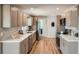 Modern kitchen featuring stainless steel appliances, sleek countertops, and light wood cabinetry at 5555 Julian St, Denver, CO 80221