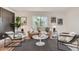 Bright living room features modern decor, large windows with serene views, and a comfortable seating area at 5555 Julian St, Denver, CO 80221