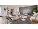 Open-concept living and dining area featuring hardwood floors, stylish decor, and plenty of natural light at 5555 Julian St, Denver, CO 80221