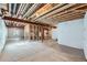 Unfinished basement space with exposed beams, plumbing, and concrete flooring, ready for customization and finishing at 11926 Barrentine Loop, Parker, CO 80138