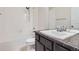 Bathroom with a tub and shower combination, single sink vanity, and tiled floors at 11926 Barrentine Loop, Parker, CO 80138