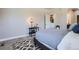 Comfortable bedroom features a cozy gray bed, stylish patterned rug, and soft natural lighting at 11926 Barrentine Loop, Parker, CO 80138