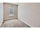 Bright bedroom features neutral walls and plush carpeting at 11926 Barrentine Loop, Parker, CO 80138
