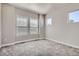 Bright bedroom with multiple windows and neutral carpet flooring at 11926 Barrentine Loop, Parker, CO 80138