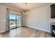 Dining room features hardwood floors and sliding glass doors to the outside at 11926 Barrentine Loop, Parker, CO 80138