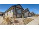 Charming exterior with neutral siding, rock landscaping, and a well-maintained lawn at 11926 Barrentine Loop, Parker, CO 80138