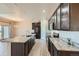 Modern kitchen with granite counters, stainless steel appliances, and a spacious island at 11926 Barrentine Loop, Parker, CO 80138