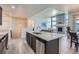Contemporary kitchen with granite countertops, stainless steel appliances, and open access to living area at 11926 Barrentine Loop, Parker, CO 80138