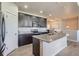 Stylish kitchen features granite countertops, stainless steel appliances, and a convenient kitchen island at 11926 Barrentine Loop, Parker, CO 80138