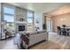 Spacious living room featuring a stone fireplace, high ceilings, and an open concept design at 11926 Barrentine Loop, Parker, CO 80138