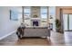 Bright living room with a floor to ceiling fireplace and large windows, offering plenty of natural light at 11926 Barrentine Loop, Parker, CO 80138