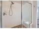 Shower features sleek glass door, tile surround, and convenient seating at 11926 Barrentine Loop, Parker, CO 80138