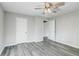 The bedroom features vinyl floors, ceiling fan and convenient access to closet and other rooms at 1437 N Uinta St, Denver, CO 80220