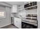 Modern kitchen with stainless steel appliances, granite countertops, and white cabinets at 1437 N Uinta St, Denver, CO 80220