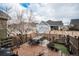 Cozy backyard with a wooden fence, outdoor table and seating, perfect for relaxing and entertaining guests at 4318 Fossil Way, Castle Rock, CO 80109