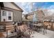 Charming backyard featuring an outdoor table, grill, butterfly decor and concrete patio for entertaining or relaxation at 4318 Fossil Way, Castle Rock, CO 80109