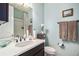 Stylish bathroom features a white vanity with updated fixtures and a shower-tub combo at 4318 Fossil Way, Castle Rock, CO 80109