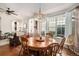 Inviting dining space with hardwood floors, large windows, and a stylish Tiffany-style pendant light at 4318 Fossil Way, Castle Rock, CO 80109