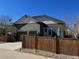 Attractive two-story home, showcasing a well-manicured front yard with a two-car garage and driveway at 4318 Fossil Way, Castle Rock, CO 80109