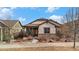 Charming single-story home with stone accents, covered porch, and well-maintained landscaping at 4318 Fossil Way, Castle Rock, CO 80109