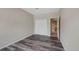 Bedroom with wood-look flooring and large closet and bathroom at 8437 Thunder Ridge Way # 202, Highlands Ranch, CO 80126