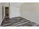 Bedroom with wood-look flooring and large closet at 8437 Thunder Ridge Way # 202, Highlands Ranch, CO 80126
