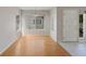 Bright dining room area features hardwood floors and large windows at 8437 Thunder Ridge Way # 202, Highlands Ranch, CO 80126